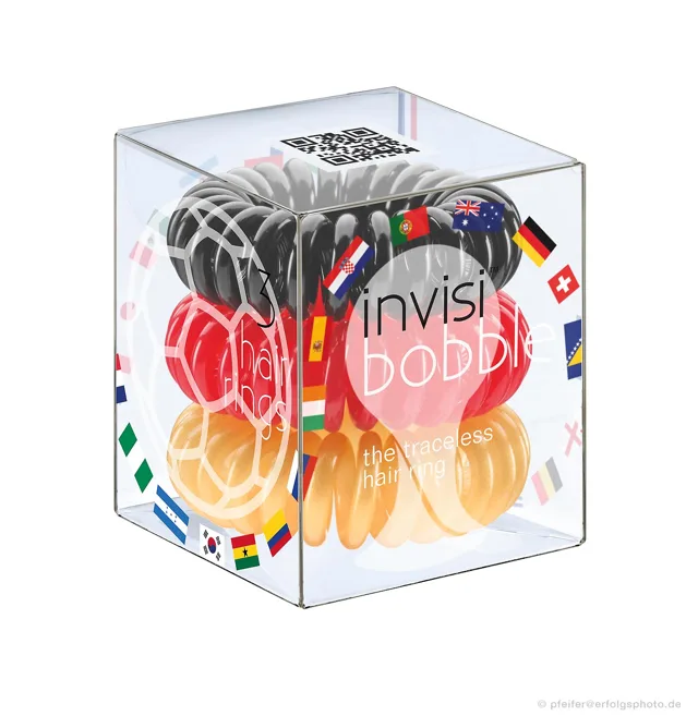 Die transparente Box lässt Inhalt und farbige Gestaltung gleichzeitig erkennen.